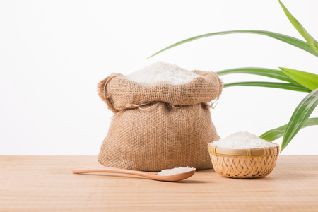 Jasmine white rice in sack isolated on white backgroundの写真素材