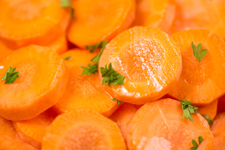 Chopped carrot slices. Fresh raw peeled carrot slice in bowl.の写真素材