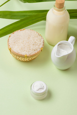 Milk and rice in bowl on light background.の写真素材