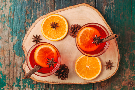 Christmas mulled wine on a rustic wooden table. Holidays concept.の写真素材
