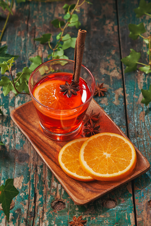 Christmas mulled wine on a rustic wooden table. Holidays concept.の写真素材