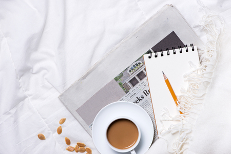 Morning Coffee and Diary with wooden pencil on cloth top view, woman creative business conceptの写真素材