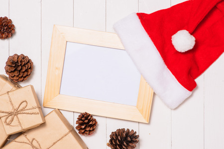 Christmas presents in decorative boxes on white wooden table backgroundの写真素材