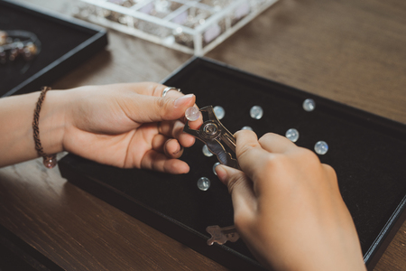 Jeweler making of handmade stone beads jewellery.の写真素材