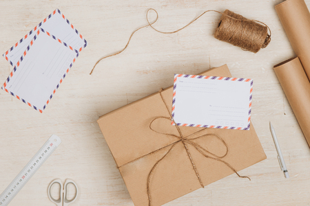 Cardboard box and envelopes on work placeの写真素材