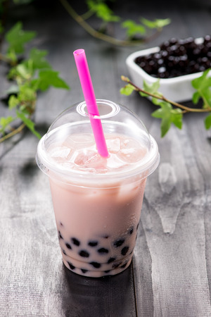 Bubble boba tea with milk and tapioca pearls in plastic cupの写真素材