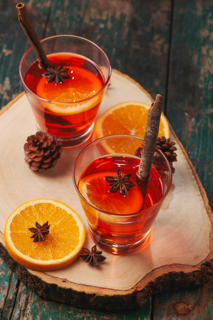 Christmas mulled wine on a rustic wooden table. Holidays concept.の写真素材