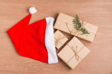 Christmas or New year gift boxes collection wrapped in kraft paper on wood background.の写真素材