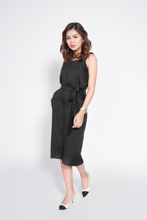 Beautiful stylish asian woman in elegant casual black outfit posingの写真素材