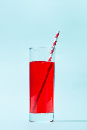 Soft drink. A glass of red soda with iceの写真素材