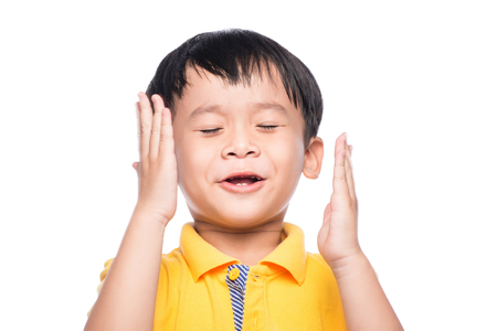 Asian little cute human child closed eye faceの写真素材