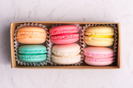 Set of different french cookies macaroons in a paper box. Top view.の写真素材