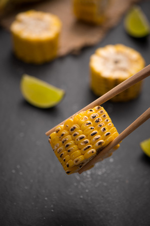 Tasty sweet grilled corn with salt and lime.の写真素材