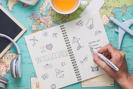 Travel. Trip. Vacation - Top view of airplane, camera, passport and touristic mapの写真素材