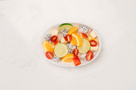 Fresh mixed fruit salad in bowl of saladの写真素材