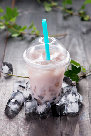 Taro bubble tea and black tapioca pearls on crushed iceの写真素材