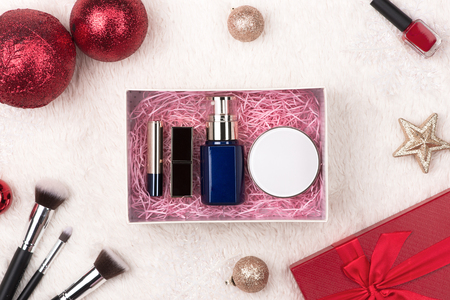 Winter holiday decoration with women cosmetics gift. Happy New Year. Merry Christmas.の写真素材
