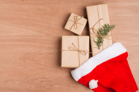 Christmas or New year gift boxes collection wrapped in kraft paper on wood background.の写真素材