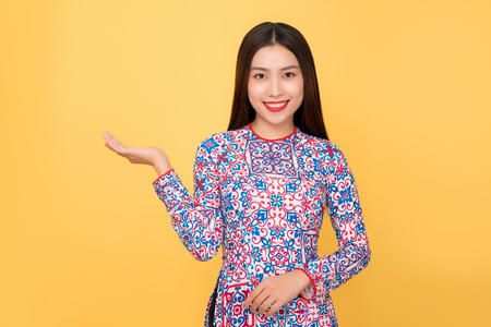 Vietnamese woman traditional festival costume Ao Dai. Tet holiday. Lunar New Year.の写真素材