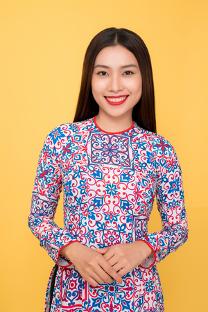 Vietnamese woman traditional festival costume Ao Dai. Tet holiday. Lunar New Year.の写真素材