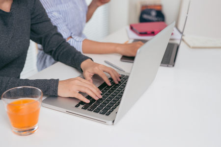 Teamwork. Businesspeople working together with laptop in office.の写真素材