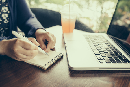 Cropped image of young woman working at home, small officeの写真素材