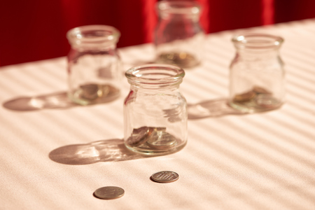 Coins in glass jar. Money savings conceptの写真素材
