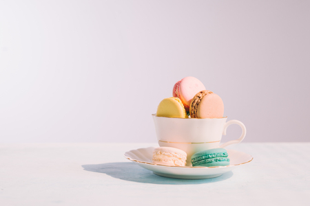 Sweet dessert. Colorful macarons on table in morning.の写真素材
