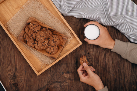 Delicious chocolate chip cookies on a tray on dark old wooden tableの写真素材