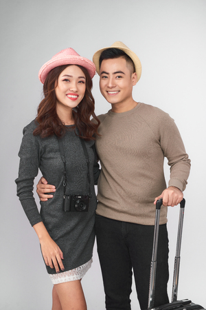 Portrait of a young beautiful couple on a tripの写真素材