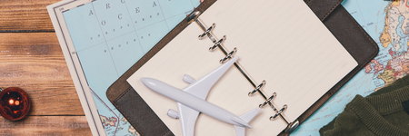 travel , trip vacation, tourism mockup - close up of clothes, christmas decorations and toy airplane...