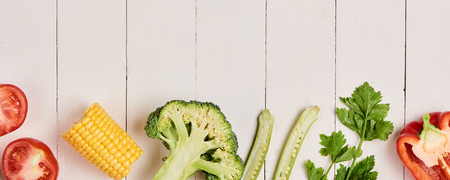 Bell pepper with measuring tape, dumbbells and bottle of water, isolated on whiteの写真素材