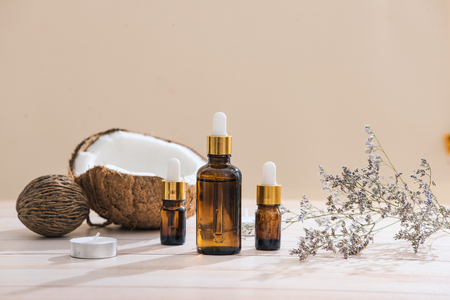 Healthy skincare. Pure coconut oil is made from organic coconut on wooden backgroundの写真素材