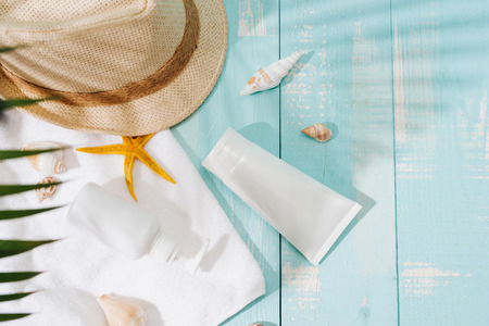 beach accessories on wooden board