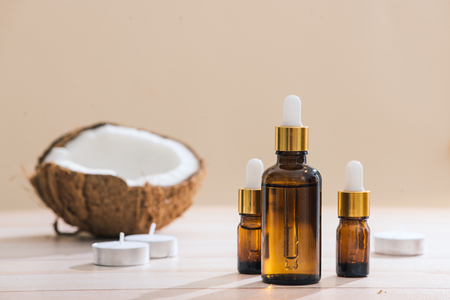 Healthy skincare. Pure coconut oil is made from organic coconut on wooden backgroundの写真素材