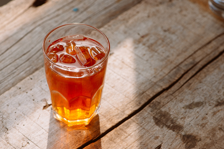 southern style iced sweet tea in two glasses rustic wooden tableの写真素材