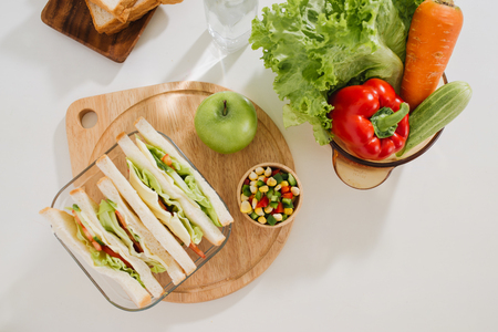 Lunch box with sandwich and fruitsの写真素材
