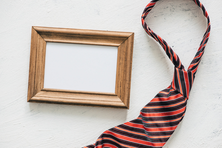 Flatlay, necktie and blank frame. Father's day conceptの写真素材