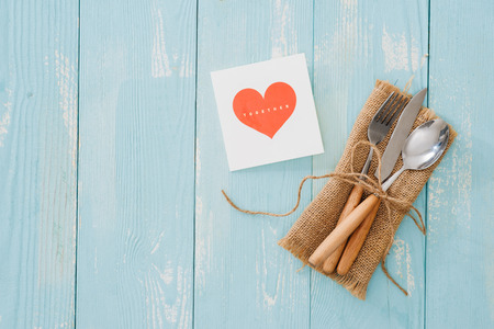 Rustic vintage set of cutlery knife, spoon, fork. Blue background. Top viewの写真素材