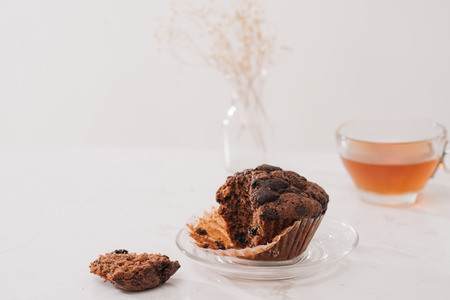 Breakfast with fresh homemade delicious muffins and tea.の写真素材