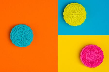 Snow skin mooncake on coloful background. Top view.の写真素材