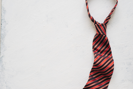 Happy Father's Day inscription with colorful tie on floor background.の写真素材