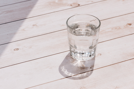 glass of water on a table in a restaurantの写真素材