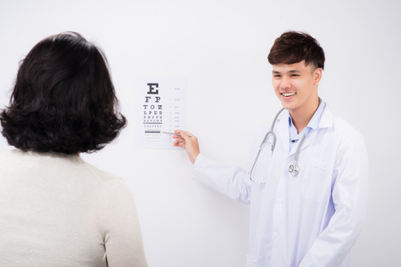 Adult male doctor examing adult female patientの写真素材