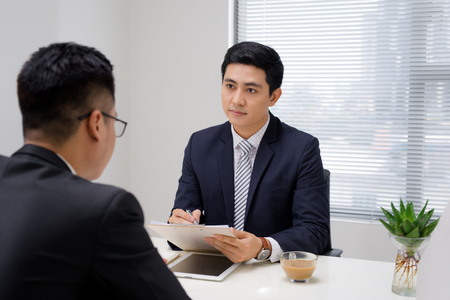 Job interview of two business professionals. Greeting new colleagueの写真素材