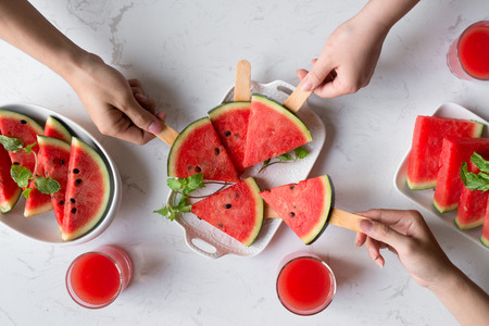 Delicious watermelon summertime snack on a plate. Dessert. Flat lay, top view.の写真素材