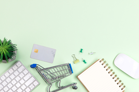 top view online shopping concept with laptop, credit card, notebook and smartphone on white table wooden background with copy space.の写真素材