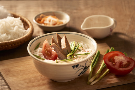 Bun cha ca - one of most popular soup noodle in the seaside area with rice noodle, grilled fish,...