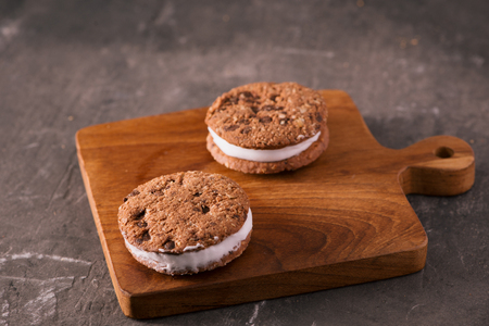 Cookie Ice Cream Sandwich Isolated on rustic wooden tableの写真素材
