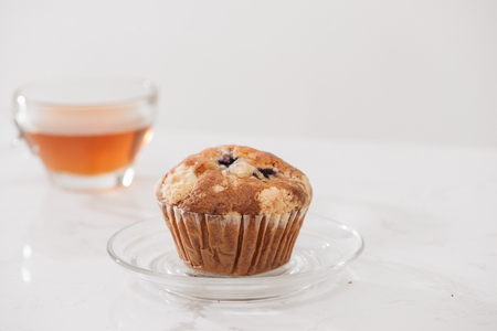 Breakfast with fresh homemade delicious muffins and tea.の写真素材